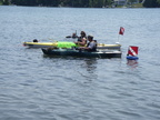 Divers Identifying Invasive Weed Problem